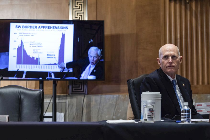 Sen. Rick Scott, R-Fla., looks on as Sen. Rob Portman, R-Ohio, speaks during a Senate Homeland Security and Government Affairs Committee hearing on Capitol Hill, in Washington, Thursday, May 13, 2021. (Graeme Jennings/Pool via AP) ** FILE **