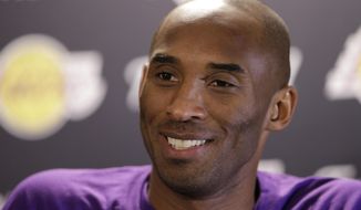 Los Angeles Lakers&#39; Kobe Bryant speaks with members of the media ahead of a basketball game against the Philadelphia 76ers in Philadelphia, in this Tuesday, Dec. 1, 2015, file photo. (AP Photo/Matt Rourke, File) ** FILE **