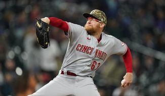 Cincinnati Reds relief pitcher Sean Doolittle works against the Colorado Rockies in the seventh inning of a baseball game Friday, May 14, 2021, in Denver. (AP Photo/David Zalubowski) **FILE**