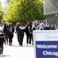 People walk along Chicago&#39;s Navy Pier, Friday, May 14, 2021. The U.S. Centers for Disease Control and Prevention eased its guidelines, saying fully vaccinated people can resume activities without wearing masks. (AP Photo/Shafkat Anowar)