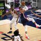 Washington Wizards guard Russell Westbrook (4) shoots against Cleveland Cavaliers forward Isaac Okoro (35), forward Mfiondu Kabengele (27), center Jarrett Allen (31) and guard Collin Sexton (2) during the second half of an NBA basketball game Friday, May 14, 2021, in Washington. (AP Photo/Nick Wass)