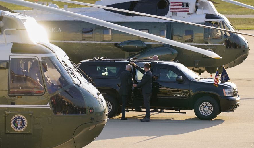 President Joe Biden boards his motorcade vehicle as he and and first lady Jill Biden arrive on Marine One, Saturday, May 15, 2021, at Delaware Air National Guard Base in New Castle, Del. (AP Photo/Carolyn Kaster)