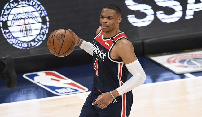 Washington Wizards guard Russell Westbrook dribbles the ball during the first half of an NBA basketball game against the Cleveland Cavaliers, Friday, May 14, 2021, in Washington. (AP Photo/Nick Wass) **FILE**