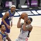 Washington Wizards guard Bradley Beal (3) goes to the basket against Charlotte Hornets forward P.J. Washington, center, during the first half of an NBA basketball game, Sunday, May 16, 2021, in Washington. (AP Photo/Nick Wass)