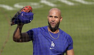 Los Angeles Dodgers first baseman Albert Pujols waves to people in the stands during batting practice prior to a baseball game against the Arizona Diamondbacks Monday, May 17, 2021, in Los Angeles. (AP Photo/Mark J. Terrill)