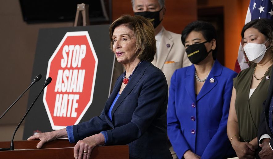 House Speaker Nancy Pelosi of Calif., left, speaks during a news conference on Capitol Hill in Washington, Tuesday, May 18, 2021, on the COVID-19 Hate Crimes Act. Pelosi is joined by Rep. Mark Takano, D-Calif., second from left, Rep. Judy Chu, D-Calif., second from right and Rep. Grace Meng, D-N.Y. (AP Photo/Susan Walsh)