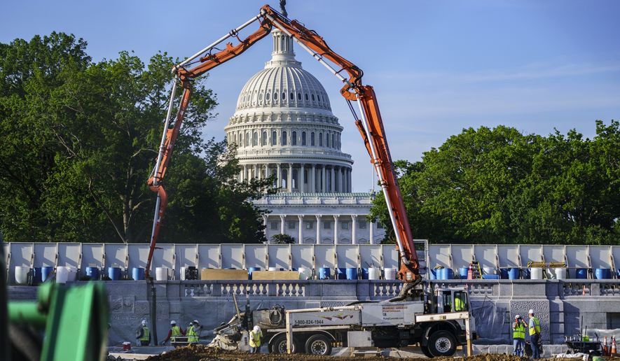 A concrete pump frames the Capitol Dome during renovations and repairs to Lower Senate Park on Capitol Hill in Washington, Tuesday, May 18, 2021. President Joe Biden hopes to pass a massive national infrastructure plan by this summer, but Democrats and Republicans in Congress appear divided over his proposal for $2.3 trillion in spending to upgrade the nation&#39;s crumbling infrastructure. (AP Photo/J. Scott Applewhite)