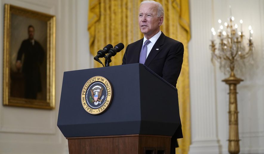 FILE President Joe Biden speaks about distribution of COVID-19 vaccines, in the East Room of the White House, Monday, May 17, 2021, in Washington.  The Biden administration announced Tuesday, May 18 it would repeal the changes made by the Trump administration to an important law made to stop banks from discriminating against racial minorities and the poor. (AP Photo/Evan Vucci)