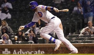 Chicago Cubs&#39; Kris Bryant watches his RBI single off Washington Nationals starting pitcher Patrick Corbin during the fifth inning of a baseball game Tuesday, May 18, 2021, in Chicago. (AP Photo/Charles Rex Arbogast)