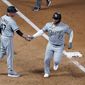 Chicago White Sox&#39;s Yermin Mercedes, right, is congratulated by third base coach Joe McEwing after his home run off Minnesota Twins&#39; Willians Astudillo in the ninth inning of a baseball game, Monday, May 17, 2021, in Minneapolis. (AP Photo/Jim Mone) **FILE**