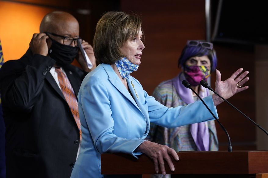 House Speaker Nancy Pelosi of Calif., center, flanked by Rep. Benny Thompson, D-Miss., left, and Rep. Rosa DeLauro, D-Conn., right, talks to reporters on Capitol Hill in Washington, Wednesday, May 19, 2021, about legislation to create an independent, bipartisan commission to investigate the Jan. 6 attack on the United States Capitol complex. Thompson is chairman of the House Homeland Security Committee and negotiated a bipartisan bill outlining a commission to investigate the Jan. 6 attack on the Capitol. (AP Photo/Susan Walsh)