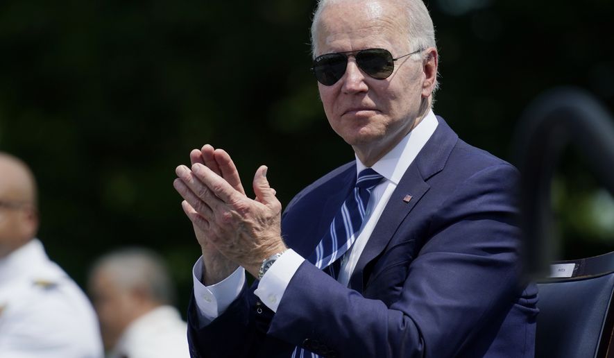 President Joe Biden applauds during the commencement for the United States Coast Guard Academy in New London, Conn., Wednesday, May 19, 2021. (AP Photo/Andrew Harnik)