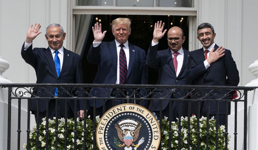 In this Tuesday, Sept. 15, 2020, file photo, Israeli Prime Minister Benjamin Netanyahu, left, U.S. President Donald Trump, Bahrain Foreign Minister Khalid bin Ahmed Al Khalifa and United Arab Emirates Foreign Minister Abdullah bin Zayed al-Nahyan pose for a photo on the Blue Room Balcony after signing the Abraham Accords during a ceremony on the South Lawn of the White House in Washington. The bloodshed in the Gaza Strip has unleashed a chorus of voices across Gulf Arab states that are fiercely critical of Israel and emphatically supportive of Palestinians. (AP Photo/Alex Brandon, File)