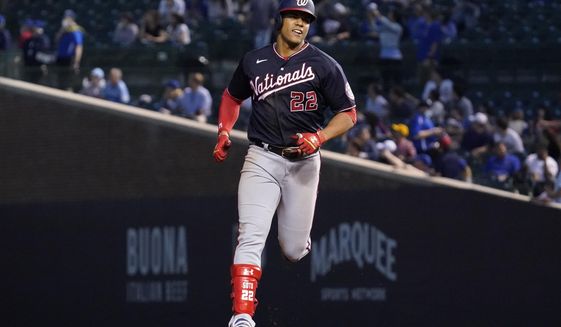 Washington Nationals&#39; Juan Soto rounds the bases after hitting a solo home run during the fifth inning of a baseball game against the Chicago Cubs in Chicago, Wednesday, May 19, 2021. (AP Photo/Nam Y. Huh)