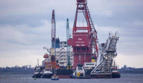 In this Jan. 14, 2021, file photo, tugboats get into position on the Russian pipe-laying vessel &#39;Fortuna&#39; in the port of Wismar, Germany. The special vessel is being used for construction work on the German-Russian Nord Stream 2 gas pipeline in the Baltic Sea. Pressure is growing on President Joe Biden to take action to prevent the completion of a Russian gas pipeline to Europe that many fear will give the Kremlin significant leverage over U.S. partners and allies. (Jens Buettner/dpa via AP) ** FILE **