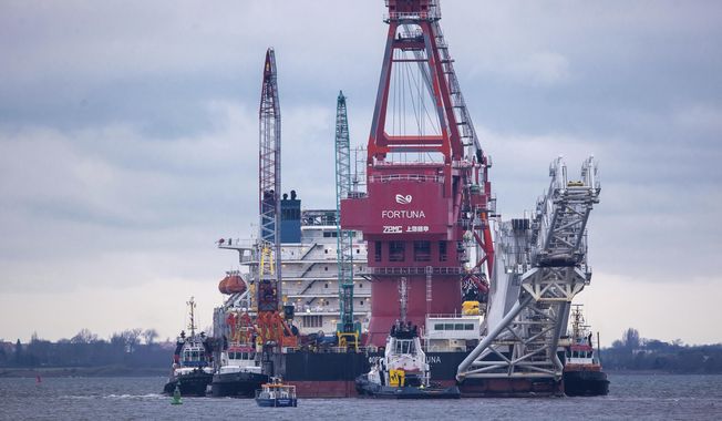 In this Jan. 14, 2021, file photo, tugboats get into position on the Russian pipe-laying vessel &#x27;Fortuna&#x27; in the port of Wismar, Germany. The special vessel is being used for construction work on the German-Russian Nord Stream 2 gas pipeline in the Baltic Sea. Pressure is growing on President Joe Biden to take action to prevent the completion of a Russian gas pipeline to Europe that many fear will give the Kremlin significant leverage over U.S. partners and allies. (Jens Buettner/dpa via AP) ** FILE **