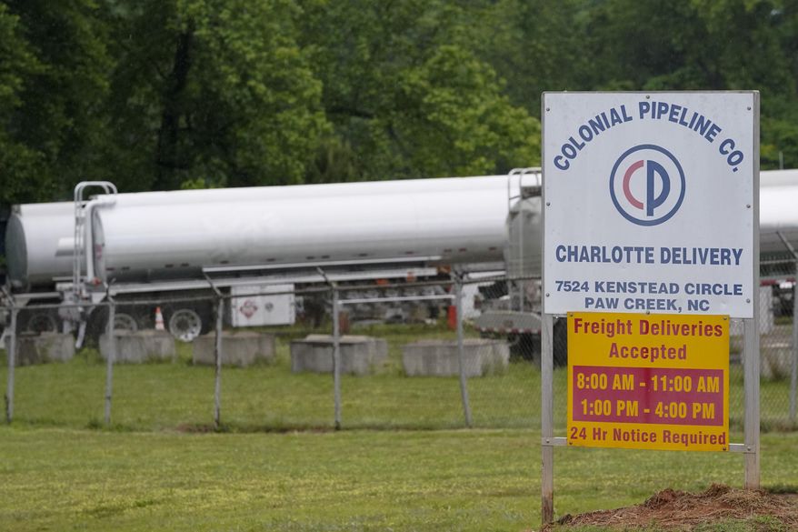 Tanker trucks are parked near the entrance of Colonial Pipeline Company Wednesday, May 12, 2021, in Charlotte, N.C. The operator of the nation’s largest fuel pipeline has confirmed it paid $4.4 million to a gang of hackers who broke into its computer systems. That&#39;s according to a report from the Wall Street Journal. Colonial Pipeline’s CEO Joseph Blount told the Journal that he authorized the payment after the ransomware attack because the company didn’t know the extent of the damage. (AP Photo/Chris Carlson) ** FILE **