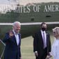 President Joe Biden, with first lady Jill Biden, waves as they walk from Marine One upon arrival on the Ellipse at the White House, Sunday, May 23, 2021, in Washington. Biden is returning from Camp David. (AP Photo/Alex Brandon)