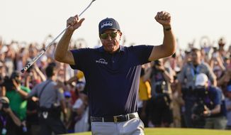 Phil Mickelson celebrates after winning the final round at the PGA Championship golf tournament on the Ocean Course, Sunday, May 23, 2021, in Kiawah Island, S.C. (AP Photo/David J. Phillip)