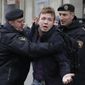 In this Sunday, March 26, 2017, file photo, Belarus police detain journalist Raman Pratasevich, center, in Minsk, Belarus. Raman Pratasevich, a founder of a messaging app channel that has been a key information conduit for opponents of Belarus’ authoritarian president, has been arrested after an airliner in which he was riding was diverted to Belarus because of a bomb threat. The presidential press service said President Alexander Lukashenko personally ordered that a MiG-29 fighter jet accompany the Ryanair plane — traveling from Athens, Greece, to Vilnius, Lithuania — to the Minsk airport. ﻿﻿(AP Photo/Sergei Grits, File)