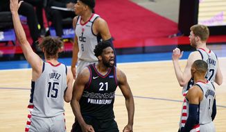 Philadelphia 76ers&#39; Joel Embiid (21) reacts after being fouled during the first half of Game 1 of a first-round NBA basketball playoff series against the Washington Wizards, Sunday, May 23, 2021, in Philadelphia. (AP Photo/Matt Slocum)