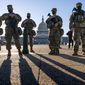 In this file photo from Wednesday, March 3, 2021, members of the Michigan National Guard join the U.S. Capitol Police to keep watch over the Capitol grounds in Washington, in the wake of the Jan. 6 insurrection by a mob loyal to former President Donald Trump. The Guard mission is ending as Democrats and Republicans spar over whether to form an independent bipartisan commission to investigate the attack that sought to overturn Trump&#x27;s loss to Joe Biden. (AP Photo/J. Scott Applewhite, file)