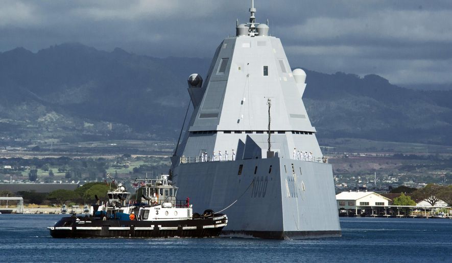 The guided missile destroyer USS Zumwalt is assisted by a tugboat at Joint Base Pearl Harbor-Hickam, in this Tuesday, April 2, 2019, file photo, in Honolulu. (Craig T. Kojima/Honolulu Star-Advertiser via AP, File)