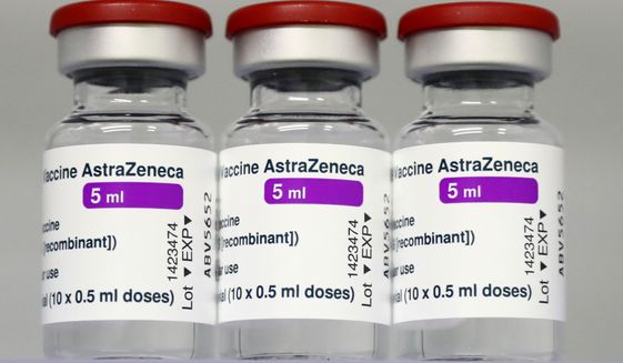 In this March 22, 2021, file photo, vials of the AstraZeneca COVID-19 vaccine sit in a fridge at the local vaccine center in Ebersberg near Munich, Germany. The European Commission will try this week to persuade a Belgian court to order the AstraZeneca pharmaceutical company to deliver millions of doses of its COVID-19 vaccines to EU countries. The EU accuses the Anglo-Swedish drugmaker of failing to deliver the number of shots it agreed. AstraZenecas contract signed with the Commission on behalf of all 27 EU member states foresaw an initial 300 million doses for distribution among member countries, with an option for a further 100 million. The doses were expected to be delivered throughout 2021 but only 30 million were sent during the first quarter. (AP Photo/Matthias Schrader, File)