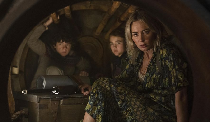 This image released by Paramount Pictures shows, from left, Noah Jupe, Millicent Simmonds and Emily Blunt in a scene from &amp;quot;A Quiet Place Part II.&amp;quot; (Jonny Cournoyer/Paramount Pictures via AP)