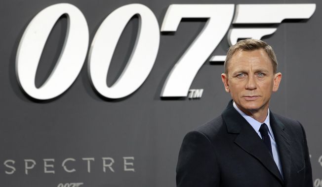 In this Oct. 28, 2015, file photo, actor Daniel Craig poses for the media as he arrives for the German premiere of the James Bond movie &quot;Spectre&quot; in Berlin, Germany. Amazon, on Wednesday, May 26, 2021, is buying MGM, the movie and TV studio behind James Bond, &quot;Legally Blonde&quot; and &quot;Shark Tank,&quot; with the hopes of filling its video streaming service with more stuff to watch. (AP Photo/Michael Sohn, File)
