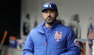 In this Sunday, April 28, 2019, file photo, then-New York Mets manager Mickey Callaway stands by the dugout before a baseball game against the Milwaukee Brewers at Citi Field, in New York. Former New York Mets manager Mickey Callaway was suspended by Major League Baseball on Wednesday, May 26, 2021 through at least the end of the 2022 season following an investigation of sexual harassment allegations. (AP Photo/Seth Wenig, File) **FILE**