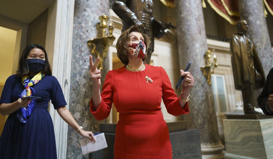 House Speaker Nancy Pelosi, D-Calif., pauses for reporters after meeting with the family of George Floyd, at the Capitol in Washington,Tuesday, May 25, 2021. (AP Photo/J. Scott Applewhite)