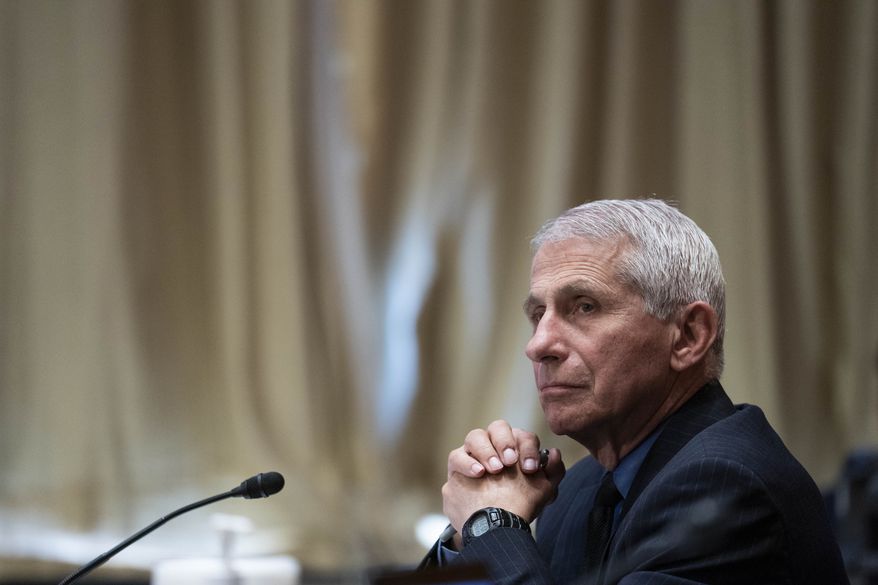 Dr. Anthony Fauci, director of the National Institute of Allergy and Infectious Diseases, listens during a Senate Appropriations Subcommittee looking into the budget estimates for National Institute of Health (NIH) and the state of medical research, Wednesday, May 26, 2021, on Capitol Hill in Washington. (Sarah Silbiger/Pool via AP) **FILE**