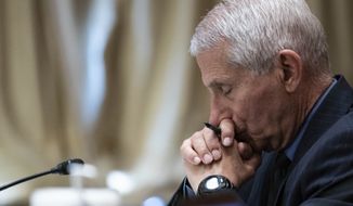 Dr. Anthony Fauci, director of the National Institute of Allergy and Infectious Diseases, listens during a Senate Appropriations Subcommittee looking into the budget estimates for National Institute of Health (NIH) and the state of medical research, Wednesday, May 26, 2021, on Capitol Hill in Washington. (Sarah Silbiger/Pool via AP)