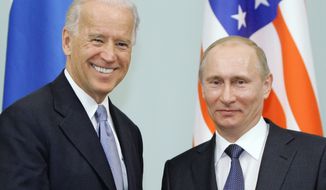 FILE - In this March 10, 2011 file photo, then Vice President  Joe Biden, left, shakes hands with Russian Prime Minister Vladimir Putin in Moscow, Russia.  President Joe Biden will hold a summit with Vladimir Putin next month in Geneva, a face-to-face meeting between the two leaders that comes amid escalating tensions between the U.S. and Russia in the first months of the Biden administration.  (RIA Novosti, Alexei Druzhinin/Pool via AP, file)