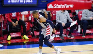 Washington Wizards&#39; Russell Westbrook limps down the court after an injury during the second half of Game 2 in a first-round NBA basketball playoff series against the Philadelphia 76ers, Wednesday, May 26, 2021, in Philadelphia. (AP Photo/Matt Slocum)
