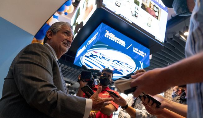 In this file photo, Ted Leonsis, Founder &amp;amp; CEO, Monumental Sports &amp;amp; Entertainment and owner of the Washington Wizards and the Washington Capitals speaks to reporters at a ribbon cutting for the William Hill Sportsbook at Monumental Sports &amp; Entertainment&#x27;s Capital One Arena in Washington, Wednesday, May 26, 2021. On July 7, Monumental announced it was created non-fungible tokens (NFTs) for both the Capitals and the Wizards.  (AP Photo/Andrew Harnik) **FILE**