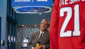 Founder &amp;amp; CEO of Monumental Sports &amp;amp; Entertainment and owner of the Washington Wizards and the Washington Capitals Ted Leonsis appears at a ribbon cutting for the William Hill Sportsbook at Monumental Sports &amp;amp; Entertainment&#39;s Capital One Arena in Washington, Wednesday, May 26, 2021. (AP Photo/Andrew Harnik)