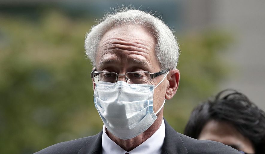 In this Sept. 15, 2020, file photo, former Nissan Motor Co. executive Greg Kelly arrives for the first trial hearing at the Tokyo District Court in Tokyo. Former Nissan chairman Carlos Ghosn has backed his former colleague American lawyer Kelly&#39;s insistence on his innocence of any wrongdoing. (Kiyoshi Ota/Pool Photo via AP, File)