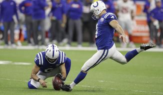 In this Dec. 23, 2018, file photo, Indianapolis Colts&#39; Adam Vinatieri (4) kicks a field goal from the hold of Rigoberto Sanchez during the second half of the team&#39;s NFL football game against the New York Giants in Indianapolis. The 48-year-old former Colts and New England Patriots star told former teammate and SiriusXM radio host Pat McAfee that he plans to retire. “By Friday, if paperwork goes in, you heard it here first,” Vinatieri said. (AP Photo/Darron Cummings, File) **FILE**