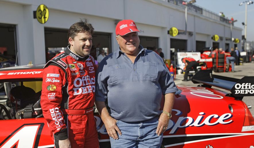 NASCAR driver Tony Stewart, left, and retired race driver, A.J. Foyt pose in the garage area during practice for the Daytona 500 auto race at the Daytona International Speedway in Daytona Beach, Fla., in this Friday, Feb. 13, 2009, file photo. Tony Stewart idolized A.J. Foyt as a child and wanted nothing more than to become the same type of racer as Super Tex. They built a decades-long friendship and will spend Sunday together at Indianapolis Motor Speedway celebrating the 60th anniversary of the first of Foyts four Indianapolis 500 victories.(AP Photo/John Raoux, File) **FILE**