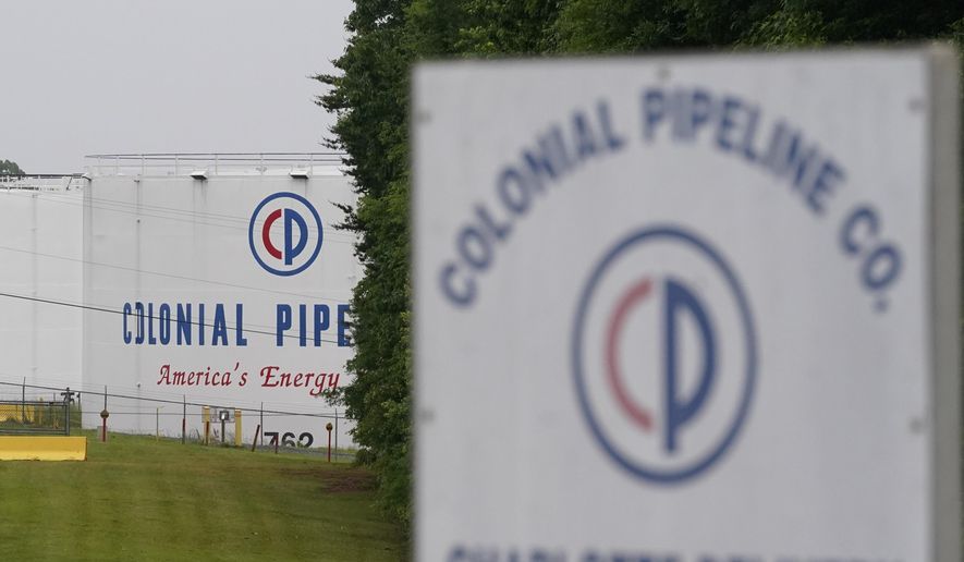 In this May 12, 2021, file photo, the entrance of Colonial Pipeline Company in Charlotte, N.C. U.S. pipeline operators will be required for the first time to conduct a cybersecurity assessment under a Biden administration directive to be issued Thursday in response to the ransomware hack that disrupted gas supplies in several states this month. (AP Photo/Chris Carlson, File)