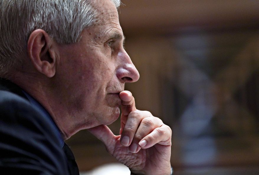 Dr. Anthony Fauci, director of the National Institute of Allergy and Infectious Diseases, listens during a Senate Appropriations Subcommittee hearing Wednesday, May 26, 2021, on Capitol Hill in Washington. (Stefani Reynolds/Pool via AP)