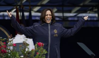 Vice President Kamala Harris displays her U.S. Naval Academy jacket at the graduation and commission ceremony at the U.S. Naval Academy in Annapolis, Md., Friday, May 28, 2021. Harris is the first woman to give the graduation speech at the Naval Academy. (AP Photo/Julio Cortez)