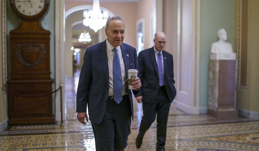 Senate Majority Leader Chuck Schumer, D-N.Y., arrives at the chamber as the Senate tries to finish to its work going into the Memorial Day recess with Republican leaders insisting they will block a commission on the Jan. 6 insurrection, at the Capitol in Washington, Friday, May 28, 2021. Lawmakers are also set to approve a big innovation bill aimed at making the U.S. more competitive with China and other countries. (AP Photo/J. Scott Applewhite)