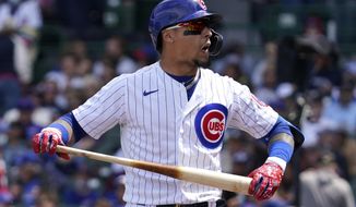 Chicago Cubs&#39; Javier Baez reacts as he walks to the dugout after being called out on strikes during the fourth inning of a baseball game against the Cincinnati Reds in Chicago, Sunday, May 30, 2021. (AP Photo/Nam Y. Huh)