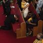 The Rev. John R. Faison Sr. kneels in prayer after preaching at a joint service for the centennial of the Tulsa Race Massacre at First Baptist Church of North Tulsa, Sunday, May 30, 2021, in Tulsa, Okla. (AP Photo/John Locher)