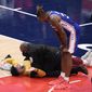 Philadelphia 76ers center Dwight Howard (39) watches as a fan who ran onto the court is restrained by security personnel during the second half of Game 4 in a first-round NBA basketball playoff series against the Washington Wizards, Monday, May 31, 2021, in Washington. (AP Photo/Nick Wass)
