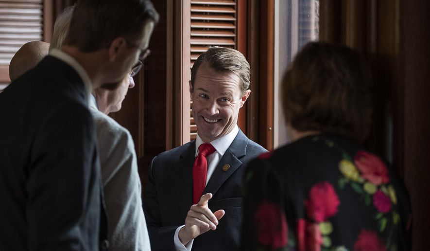 House Speaker Dade Phelan, R-Beaumont, talks to Republican members of the Texas House before the start of the debate of Senate Bill 7, known as the Election Integrity Protection Act, at the Capitol on Sunday, May 30, 2021, in Austin, Texas. (Jay Janner/Austin American-Statesman via AP)