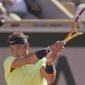 Spain&#39;s Rafael Nadal plays a return to Australia&#39;s Alexei Popyrin during their first round match on day three of the French Open tennis tournament at Roland Garros in Paris, France, Tuesday, June 1, 2021. (AP Photo/Christophe Ena)